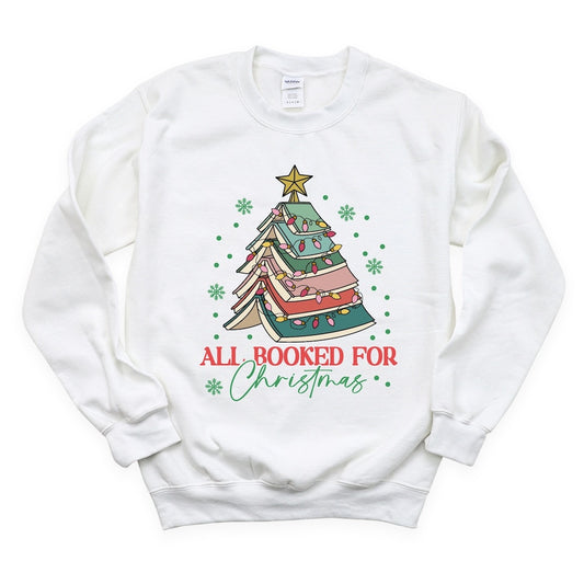 Image shows a DTF transfer printed on a sweatshirt that shows a Christmas Tree made of books.