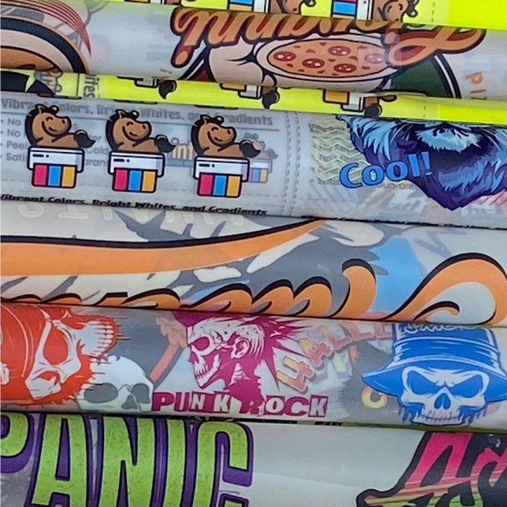 Image shows colorful printed DTF Gang sheets from PrintPony.